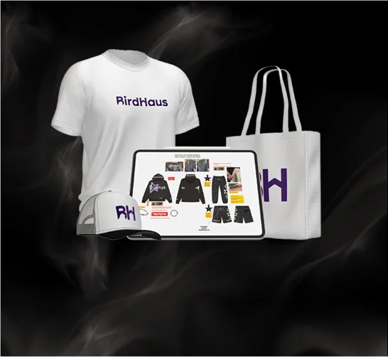 White BirdHaus tee, trucker cap and tote bag beside a tablet showing a garment tech pack